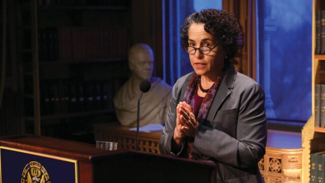 maria cancian speaking at podium