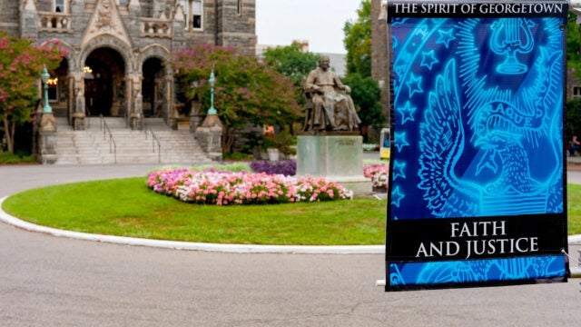 campus sign in front of healy hall
