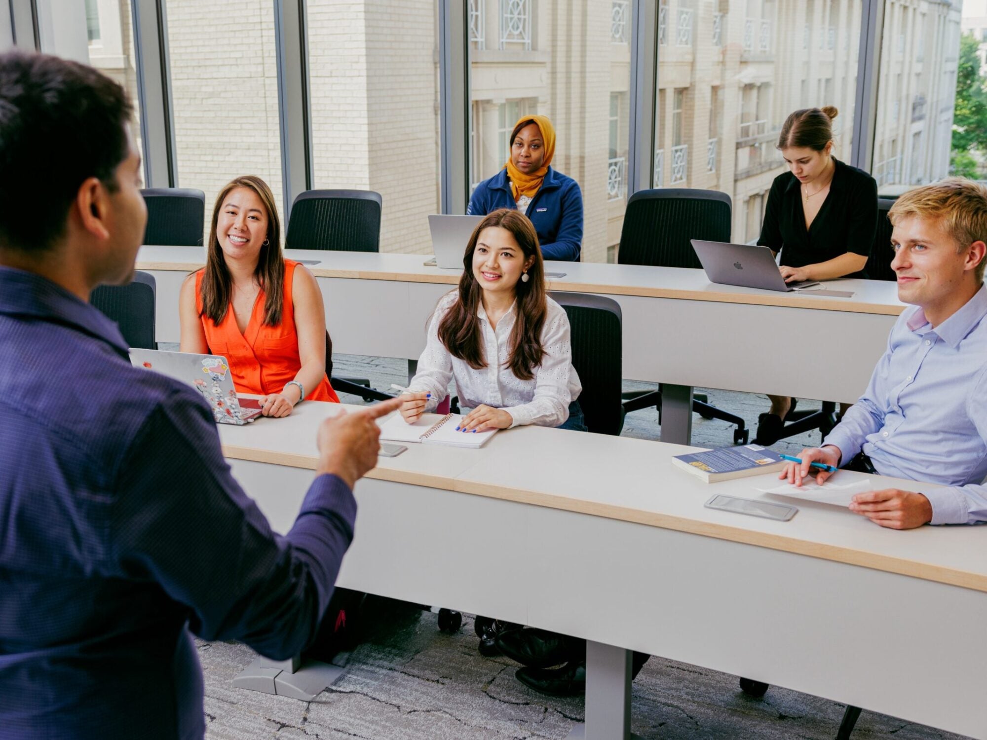 teacher talking to students