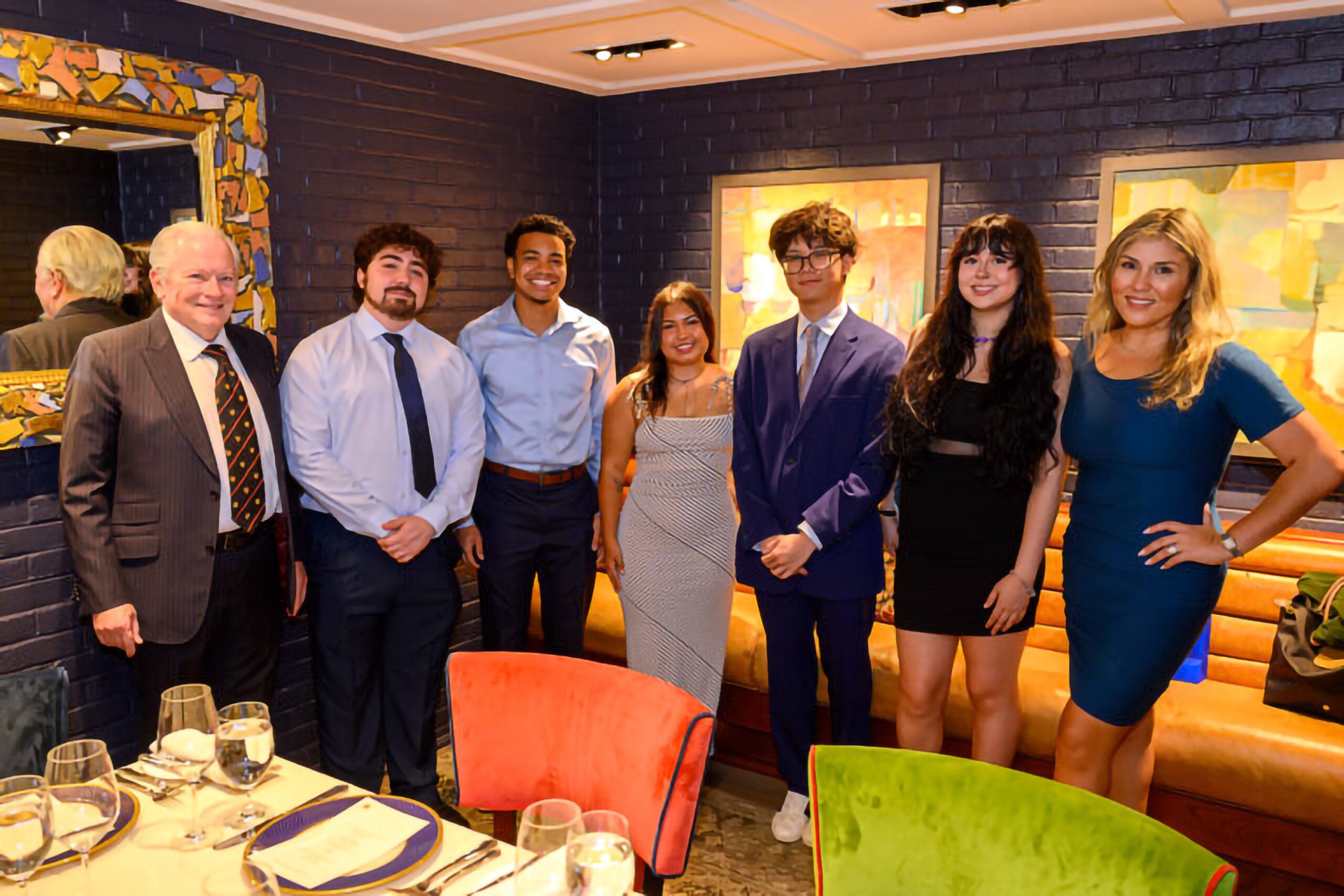 The inaugural class of Stahl Summer Scholars celebrates with Stephen and Shakila Stahl.
