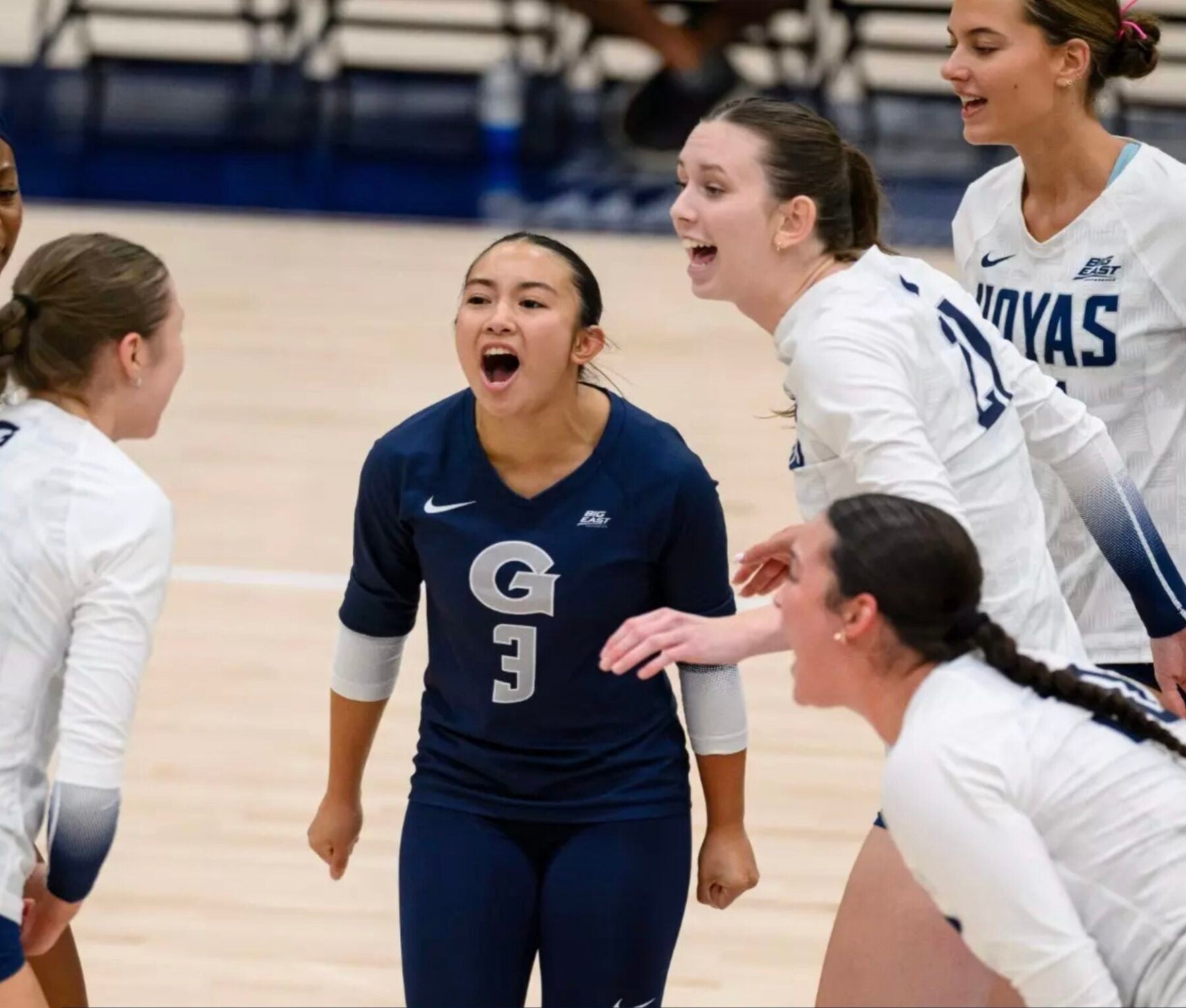 volleyball players celebrating