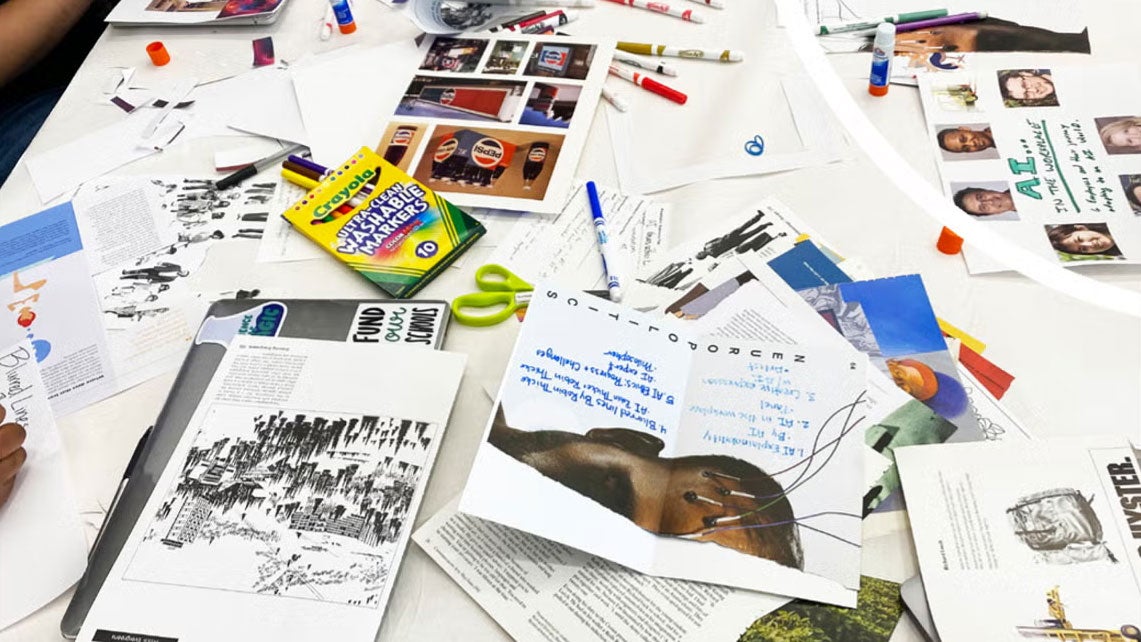 spread of paper, pens and magazines