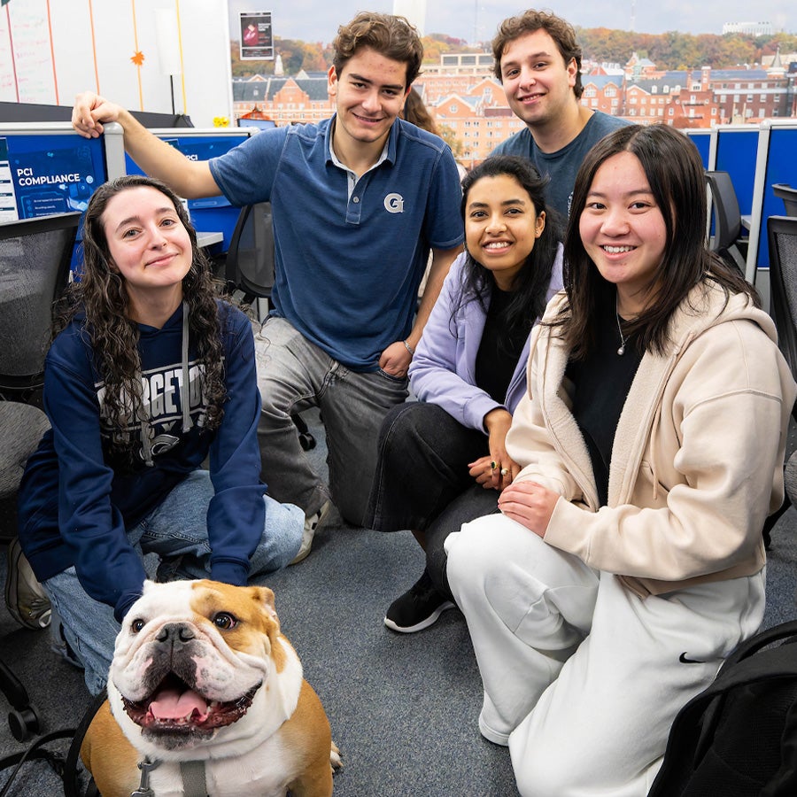 students posing with jack the bulldog