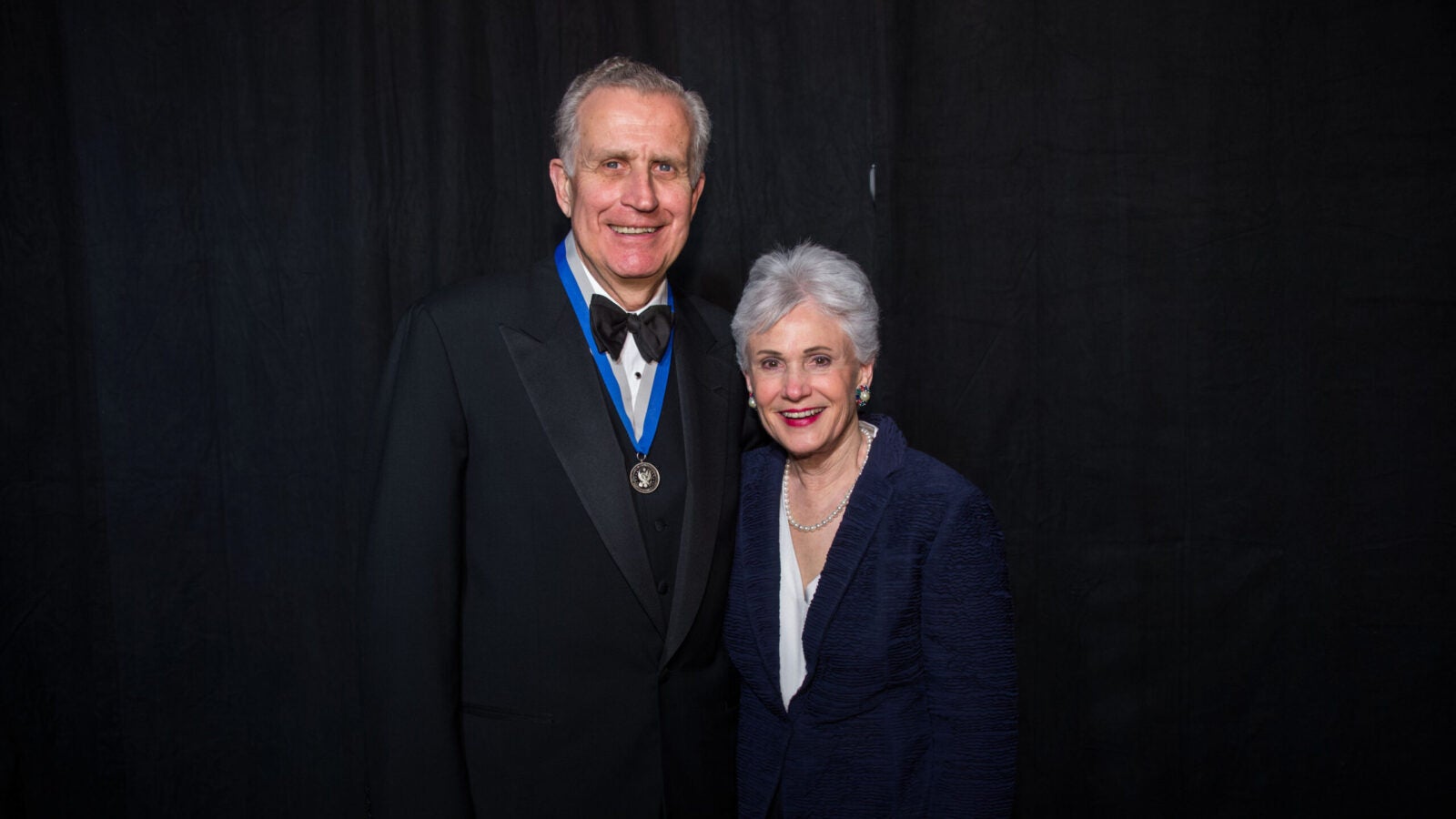 paul tagliabue and his wife posing